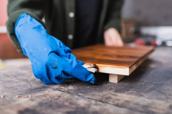 Cropped View Carpenter Rubber Glove Applying Wood Stain Board — Stock Photo, Image