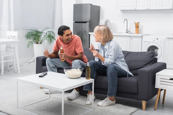 Excited Multiethnic Couple Cheering While Watching Sport Match Living Room — Stockfoto