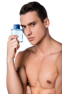 man with naked chest holding vial of perfume isolated on white clipart