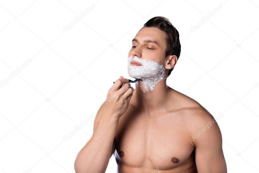 muscular man with naked chest shaving isolated on white