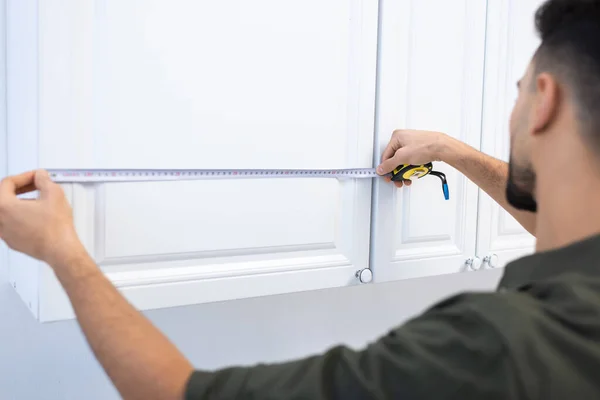 Blurred Muslim Man Measuring Kitchen Cabinet Home — 图库照片