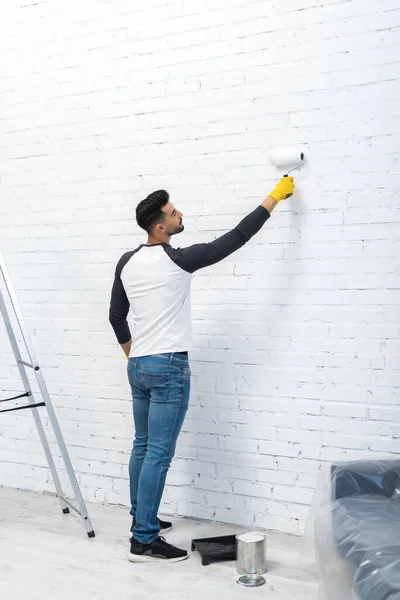 Side View Young Muslim Man Coloring Wall Dye Ladder Home — Stockfoto