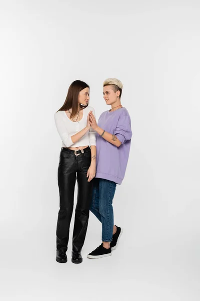Full Length Stylish Lesbian Women Joining Hands Looking Each Other — Foto Stock