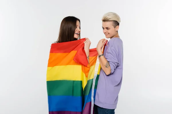 Tattooed Woman Smiling Girlfriend Wrapped Lgbtq Flag Isolated Grey —  Fotos de Stock