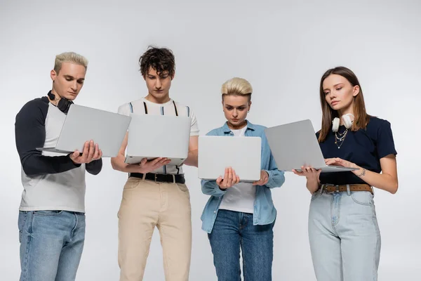 Young Freelancers Trendy Clothes Using Laptops Isolated Grey — Stock Photo, Image