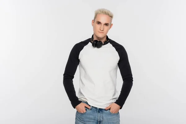 Blonde Man Headphones Holding Hands Pockets Jeans Isolated Grey — Stock Photo, Image