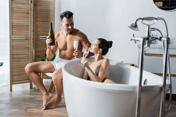 Happy Sexy Couple Holding Champagne Glasses Talking Bathroom — Stock Photo, Image