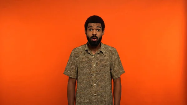 Shocked African American Man Opened Mouth Looking Camera Orange Background — Stock Photo, Image