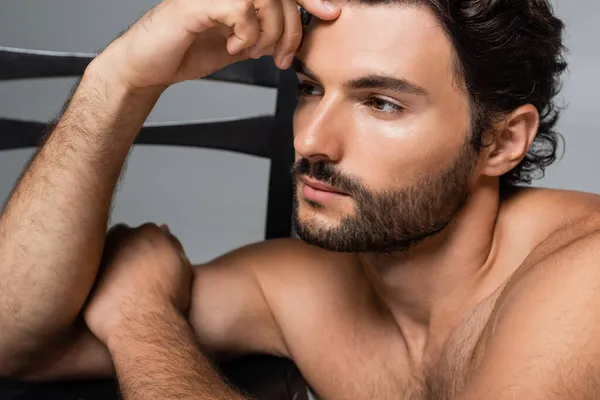 Portrait of pensive good-looking man looking away isolated on grey — Stock Photo