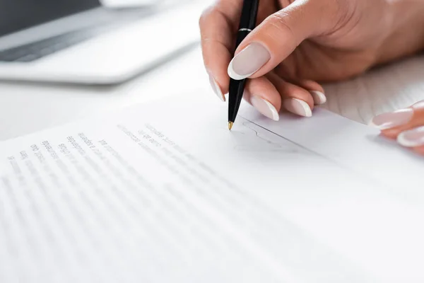Partial view of businesswoman signing document — Stock Photo