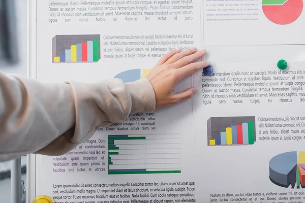 Cropped view of manager discovering charts in office — Stock Photo