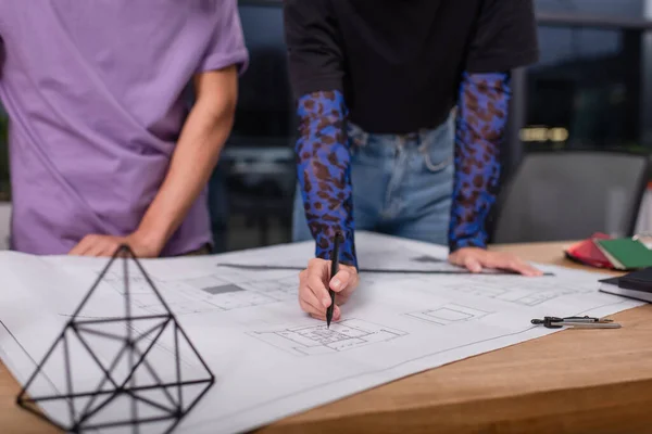 Cropped view of interior designers working with blueprint in office — Stock Photo