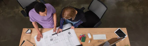 Top view of multiethnic interior designers working with blueprint, banner — Stock Photo