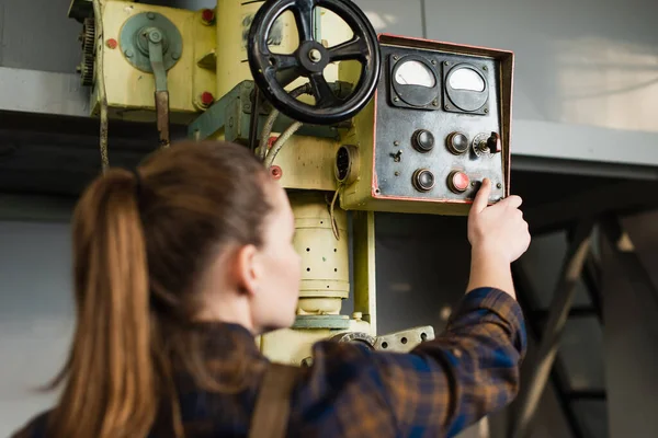 Blurred welder tuning welding machine in factory — Foto stock