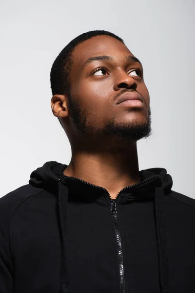 African american man in hoodie looking away isolated on grey — Fotografia de Stock