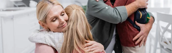 Grandparents hugging schoolkids at home, banner — Stock Photo