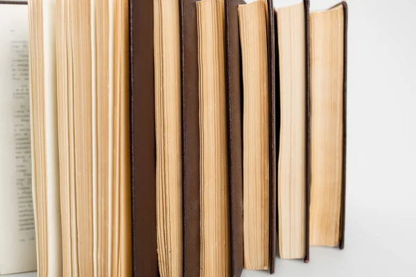 Close up view of several paper books on grey background — Stock Photo