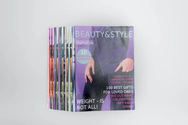 Top view of colorful beauty and style magazines isolated on grey — Stock Photo