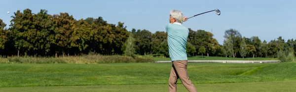 Asian senior man playing golf, banner — Stock Photo