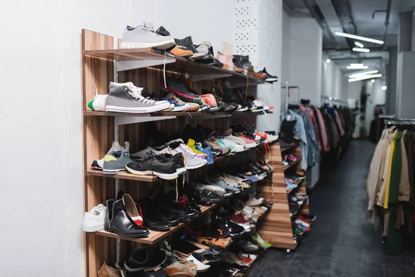Shoes on rack in second hand — Stock Photo