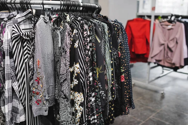 Blouses on hangers in second hand — Foto stock