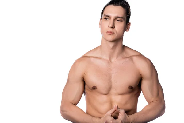 Hombre sin camisa con cuerpo fuerte mirando hacia otro lado aislado en blanco - foto de stock