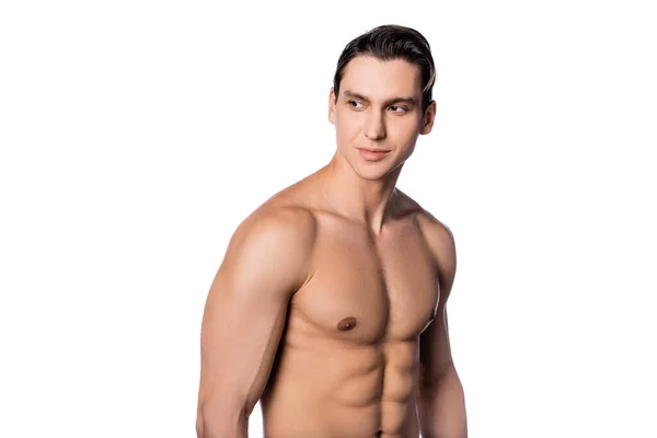 Hombre sonriente con torso muscular mirando hacia otro lado aislado en blanco - foto de stock