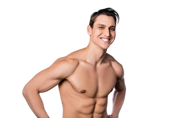 Hombre alegre con cuerpo perfecto mirando a la cámara aislada en blanco - foto de stock