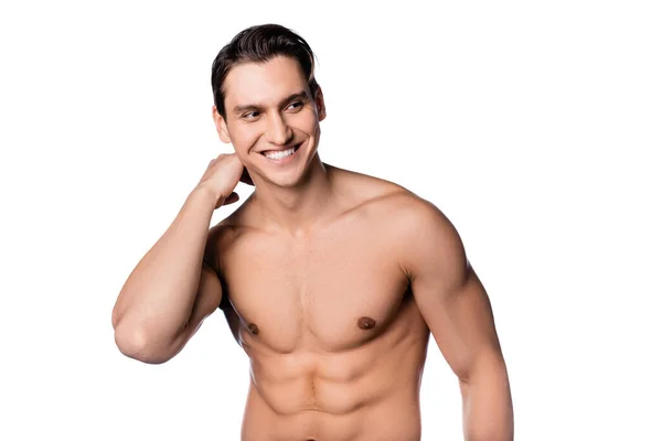 Happy shirtless man touching neck and looking away isolated on white — Stock Photo