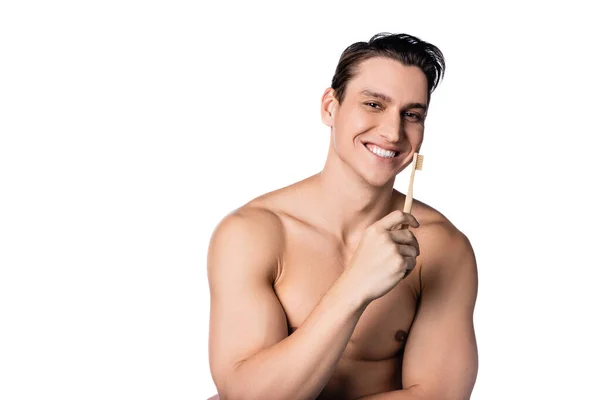 Cheerful shirtless man with toothbrush looking at camera isolated on white — Stock Photo