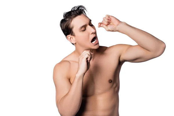 Brunette shirtless man flossing teeth isolated on white — Stock Photo