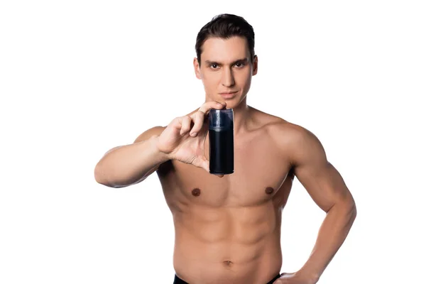 Shirtless man with hand on hip showing deodorant isolated on white — Stock Photo