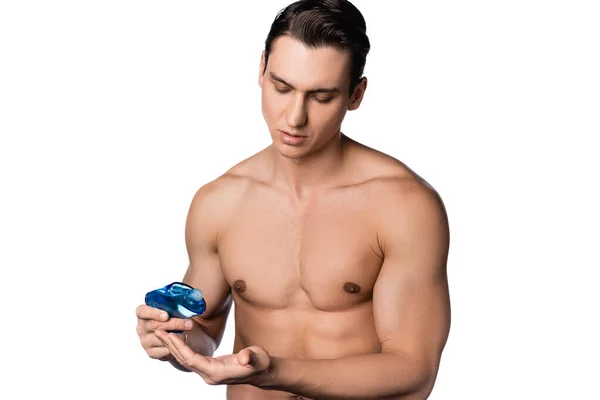 Uomo senza maglietta con corpo muscolare che si applica dopo la lozione rasatura a portata di mano isolato su bianco — Foto stock