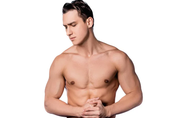 Brunette shirtless man standing with clenched hands isolated on white — Stock Photo