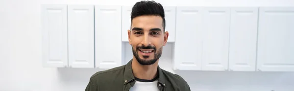 Positive muslim man looking at camera at home, banner — Fotografia de Stock