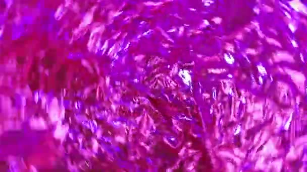 Iridescent gift paper With party lights.Rotation background for event.Sparkling shiny lights.rainbow colours.4k video footage. music bakgrounds. Banner with defocused lights — Stock Video