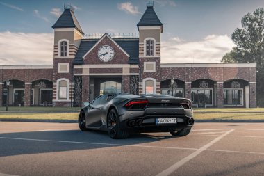 Italian supercar Lamborghini Huracan Spyder in a gray color. Kyiv, Ukraine - June 2021.