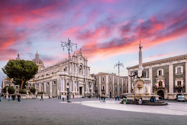 Catania, Italy - March 2022: Piazza Duomo of Catania with its cathedral and the elephant fountain, symbols of the city, during a sunset
