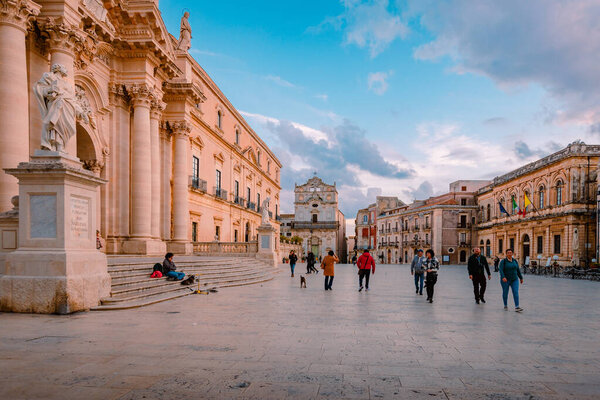 Syracuse, Italy - March 2022: Cathedral Square in Syracuse with tourists walking