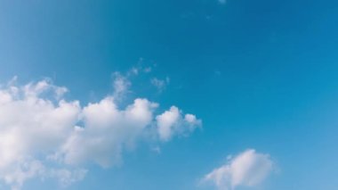 White moving clouds disappearing over blue sky, Timelapse, 4K