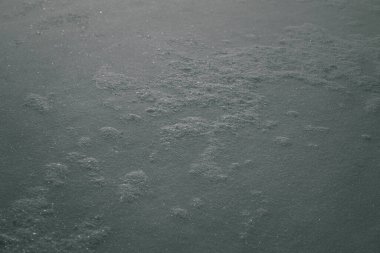Abstract gray background, snow texture. Winter grey wallpaper.