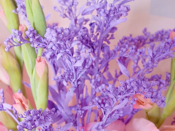 Bouquet composition with blue dry branch and gladiolus. gentle beautiful pastel romantic floral composition.Postcard, congratulations