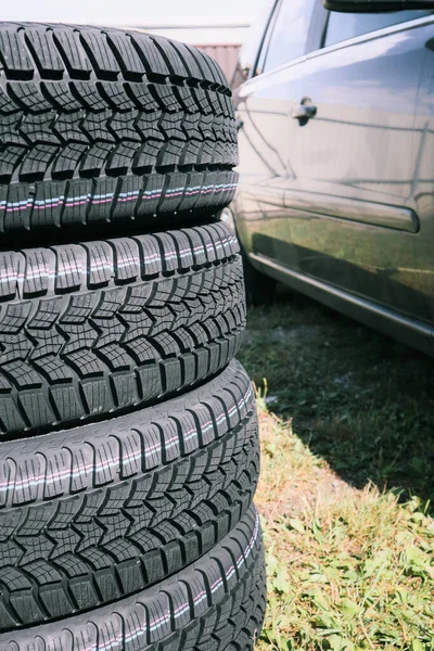 Four New Snow Tires Backyard Set Studded Winter Car Tires —  Fotos de Stock