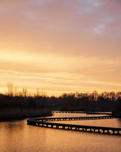 Boardwalk at Zuidpolder park in Barendrecht, the Netherlands during sunrise