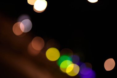 turuncu bokeh ışık daireleri siyah arkaplan üzerinde