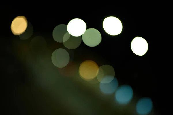 bokeh colored circles of light on black background