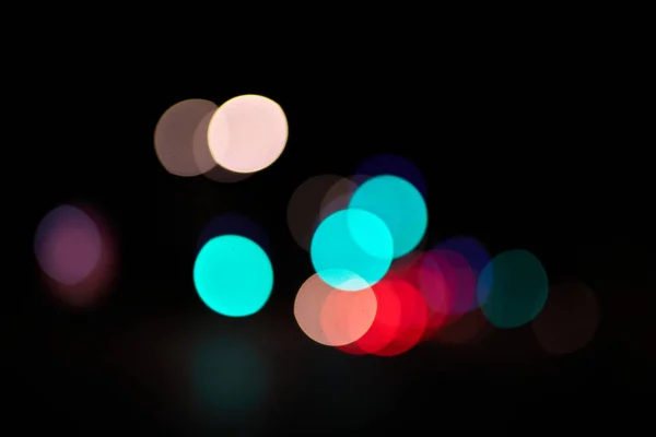 bokeh colored circles of light on black background