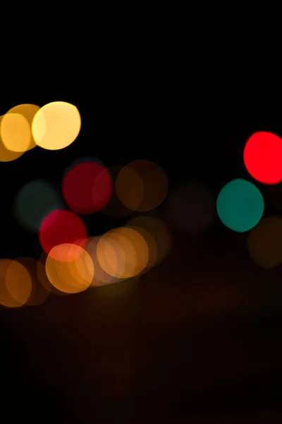 bokeh colored circles of light on black background