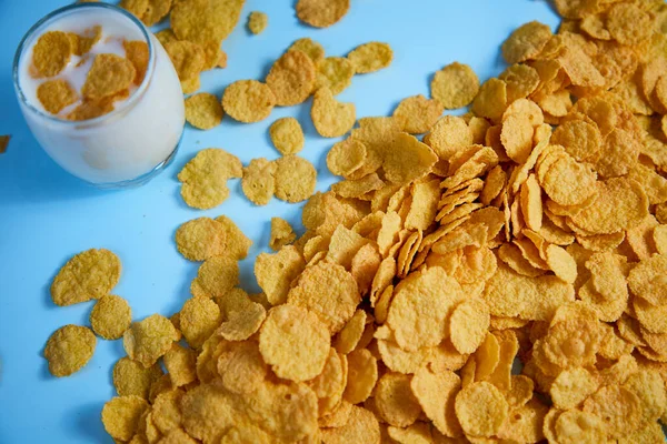 corn flakes in a glass with milk top view