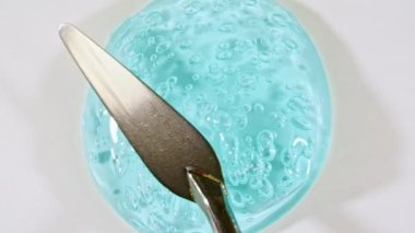 Sıvı krem, mavi kozmetik doku. Kaplama, karalama geçmişi. Organik kozmetik, ilaç. Üst Manzara. 4K